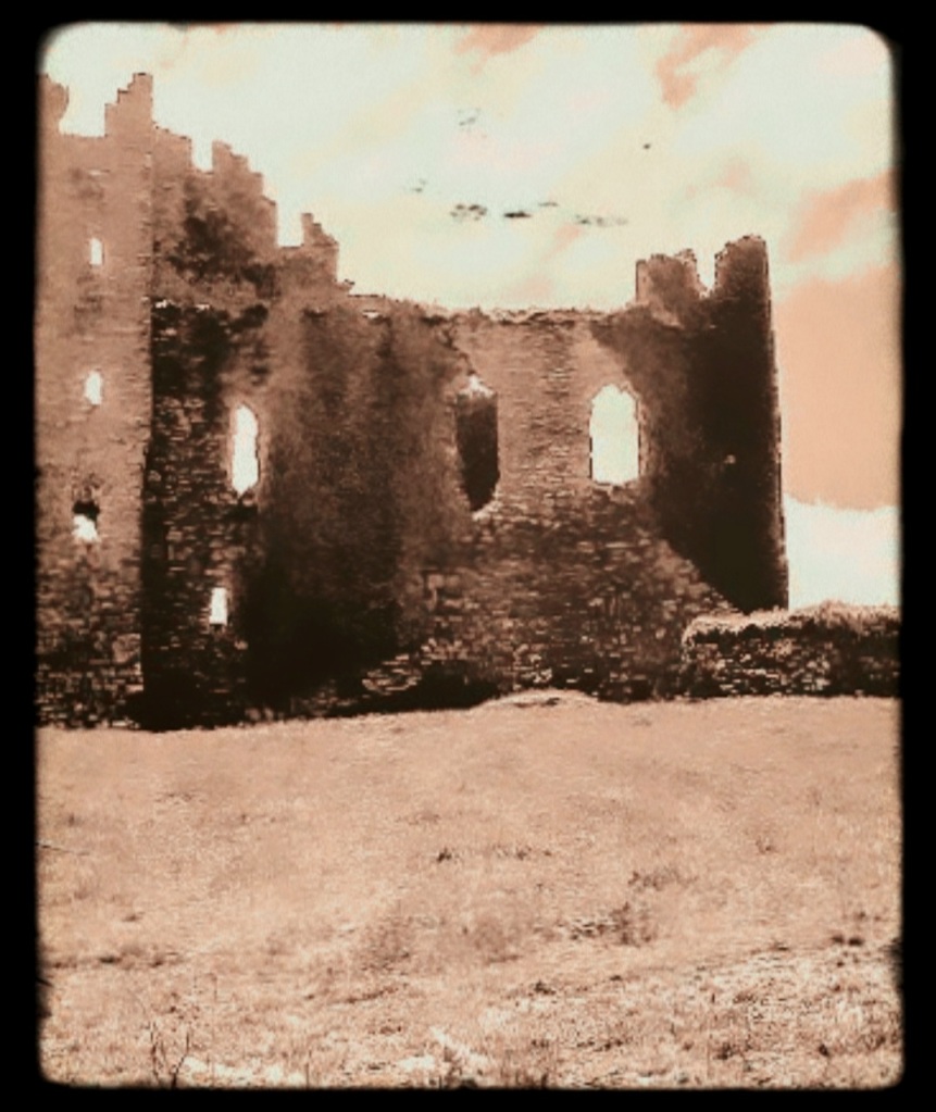An artfully altered photo of a romantically derelict Irish castle.